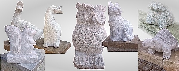 Assortimento di animali da giardino in pietra